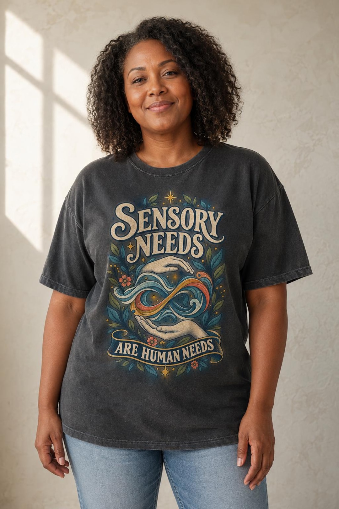 Model wearing the Sensory Needs Are Human Needs Autism Acceptance Shirt
